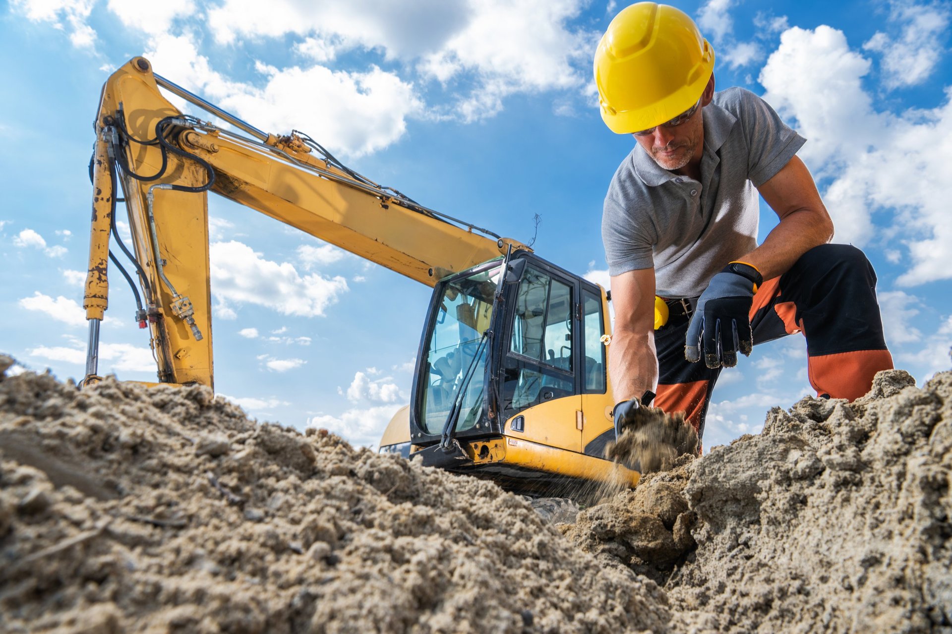Construction worker with excavator